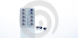 Dark blue capsule pills with blister pack of Echinacea Purpurea extract for immune health isolated on white background. Herbal