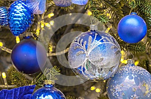 Dark blue Christmas balls on Christmas tree. Christmas and New Year\'s decor.