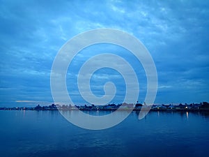 Dark blue cloud with white light sky background and light