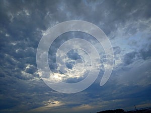 Dark blue cloud with white light sky background and light