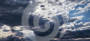 dark blue dramatic sky with thunderclouds in stormy weather. Panorama of sky