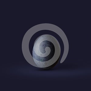 Dark blue easter egg on dark background