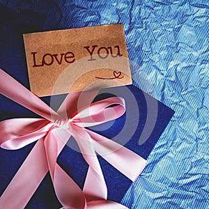 Dark blue gift box with ribbon decoration and Love You text car