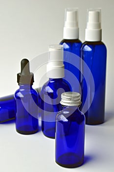 Dark blue glass bottles for cosmetic lotions, serums, oils