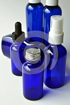 Dark blue glass bottles for cosmetic lotions, serums, oils