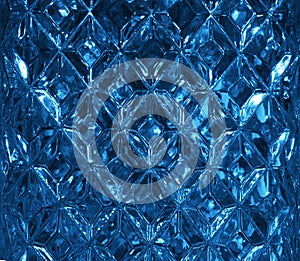 Dark blue glass texture with a pattern of rhombuses. Clear glass diamond shape. Crystals