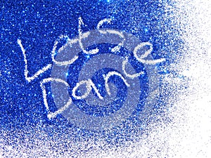 Dark blue glitter sparkle with words Let's Dance on white background