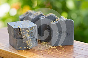 Dark blue handmade soap on a green background