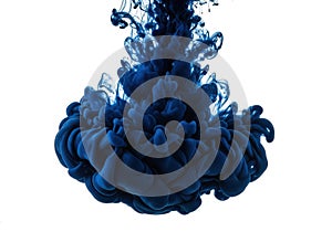 Dark blue ink cloud exploding in water isolated on white background