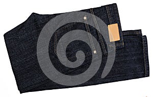 Dark blue jeans with tag. Isolated.