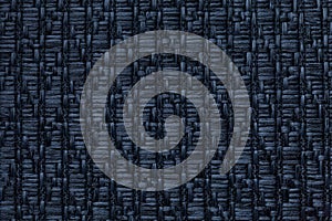 Dark blue knitted woolen background with a pattern of soft, fleecy cloth. Texture of textile closeup.