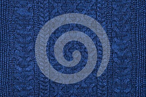 Dark blue sweater knit textured background. photo