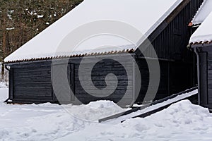 Dark blue Kurzeme harbour warehouse under snow photo