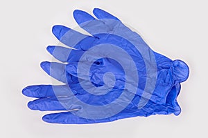 Dark blue latex medical gloves on white background.