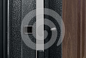 Dark Blue Metallic Door With Long Handle And Keyhole