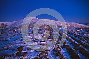 Dark blue mountains, first snow on the ridge, edit space. Fatra, Slovakia