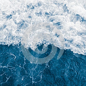 Dark blue ocean wave and white foam