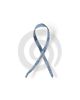 Dark blue paper ribbon symbol of colon cancer isolated on white background