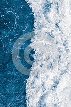 Dark blue sea ocean wave and  liquid white foam