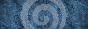 Dark blue stone background. Toned teal rock texture. Detail. Marble effect. Panorama. Wide banner with beautiful pattern texture.