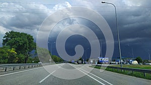 dark blue storm clouds meet all motorists