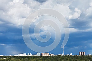 Dark blue storm clouds over city in summer