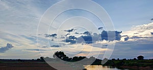 Dark blue stormy sky with clouds, abstract nature background. Blue sky panorama background with clouds in the morning. Blue sky