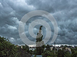 Dark blue stormy sky under households. Background