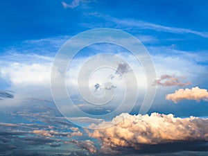 dark blue sunset sky with cumuli clouds in summer