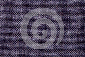 Dark blue textile background with checkered pattern, closeup. Structure of the fabric macro.