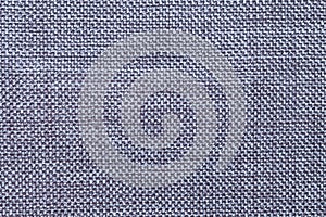 Dark blue textile background with checkered pattern, closeup. Structure of the fabric macro.