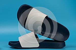 Dark blue and white flip flops