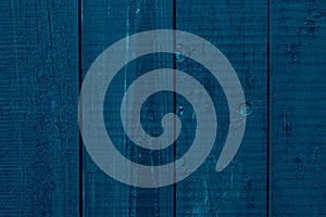 Dark blue wooden fence, desk surface. Weathered timber, background. Retro wood planks. Old shabby boards, texture. Rustic table of