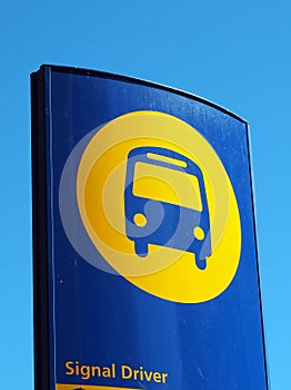 Blue and Yellow Bus Stop Sign