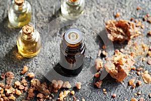 A dark bottle of essential oil with myrrh resin