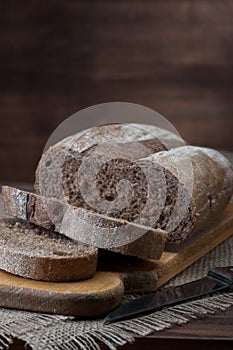 Dark Bread on wooden background