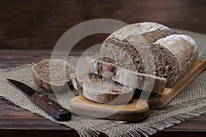 Dark Bread on wooden background