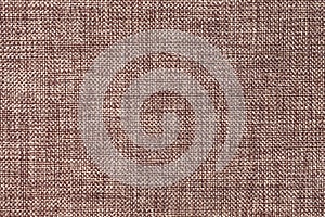 Dark brown background of dense woven bagging fabric, closeup. Structure of the textile macro.