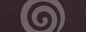 Dark brown background from a textile material with wicker pattern, closeup. Structure of vintage umber fabric