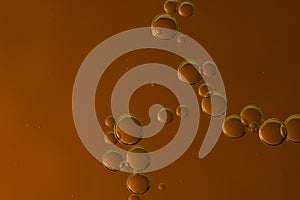 Dark brown bubbles over a gradient background