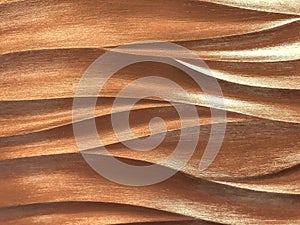 Dark brown 3D interior decorative wall panel with wavy pattern. Texture of pearl bronze background