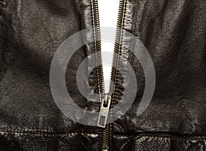 Dark brown leather jacket with the zip partly open