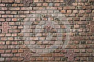 Dark brown red brick wall