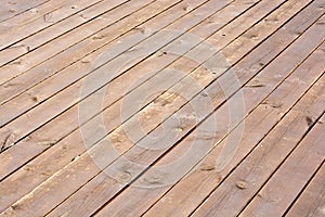 Dark brown scratched wooden cutting board. Wood background texture. Old wood plank.