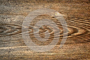 Dark brown scratched wooden cutting board. Wood texture.