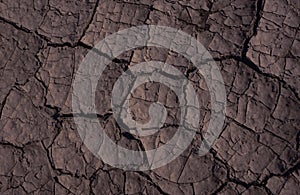 Dark brown texture Cracked earth drought