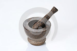 Dark Brown Wooden Mortar and Pestle on White Background.