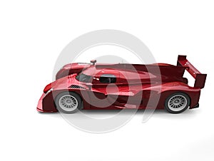 Dark candy red modern super race car - top down side view