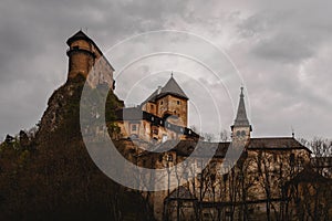 Dark castle on the top of the cliff.