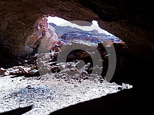 a dark cave in a rock in Bechar